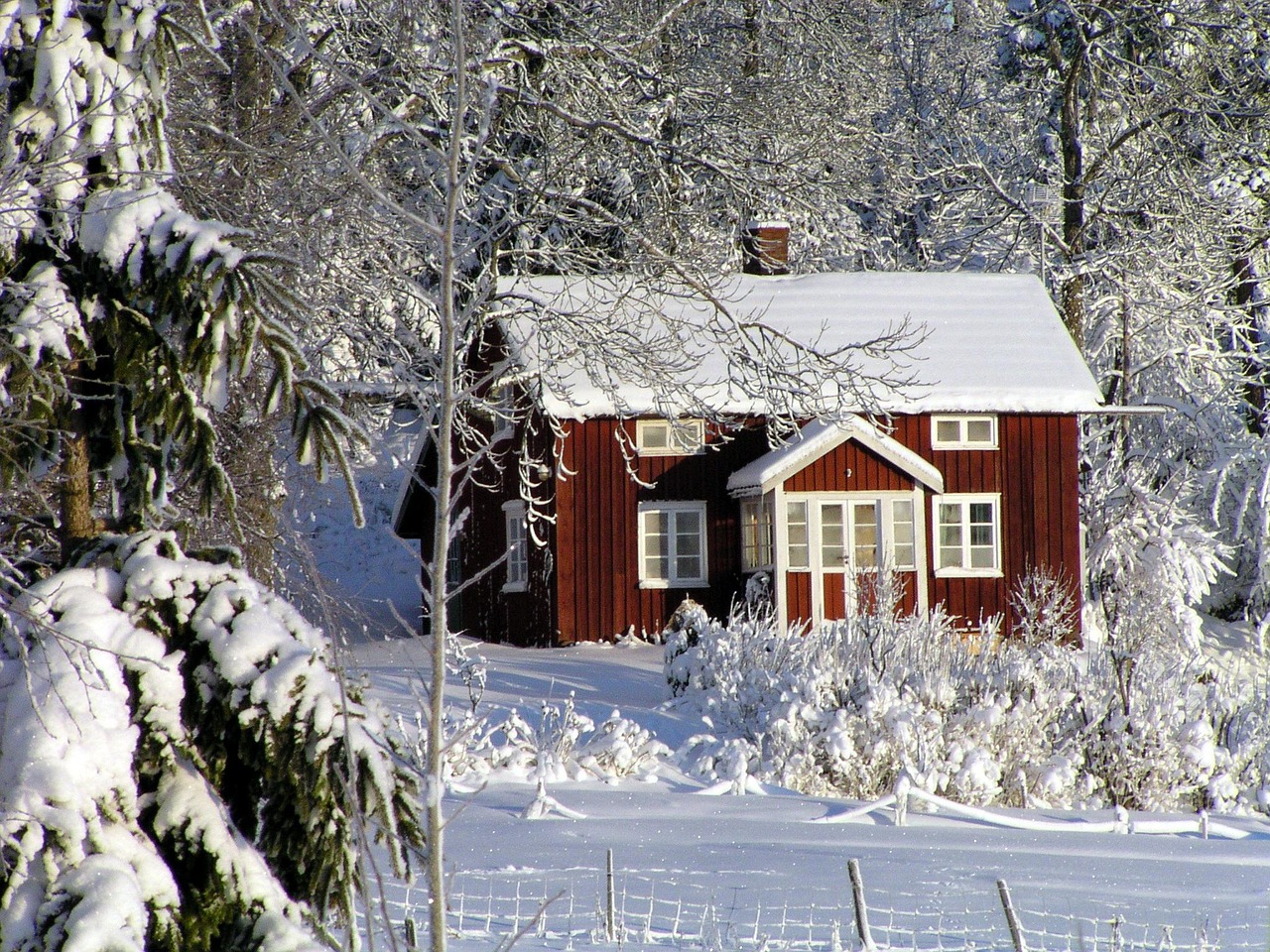 Snow-covered house roof in winter